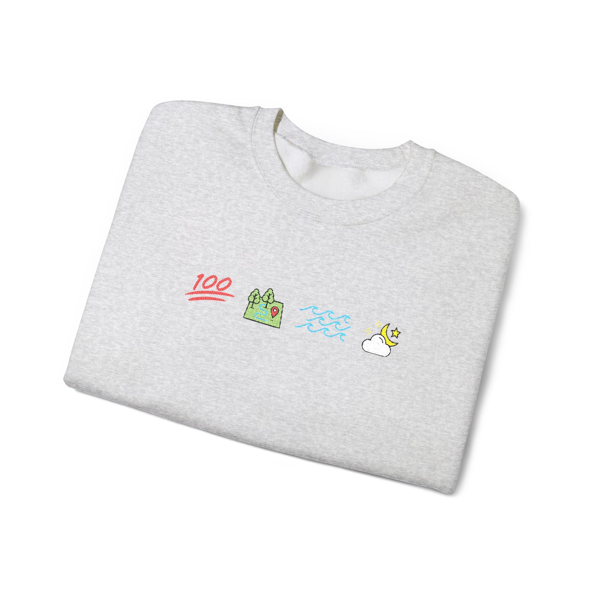 Folded gray sweatshirt with colorful graphics on a white background