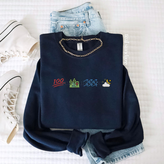 Navy blue sweatshirt with Ophelia themed embroidered designs on a white background